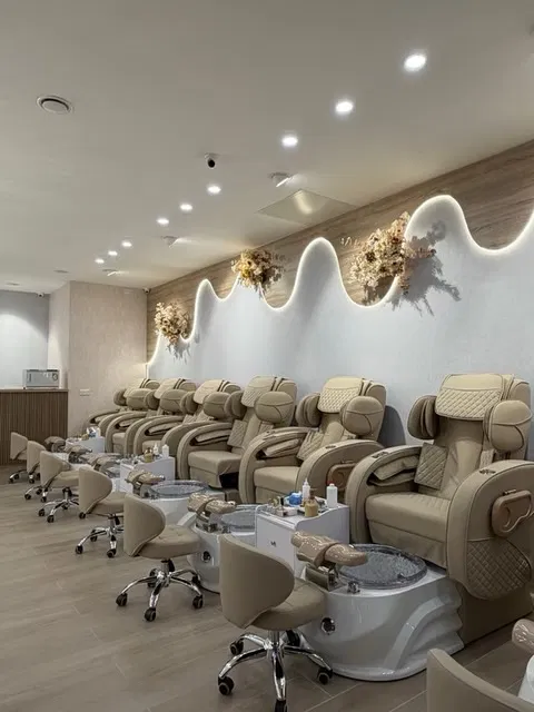 Nail salon interior with pedicure chairs